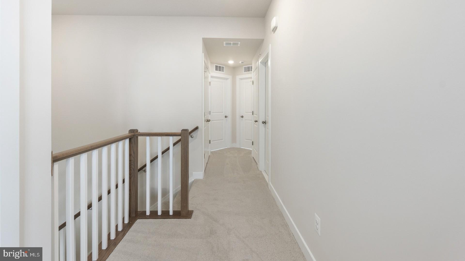 20821 Cloongee Terrace Sterling, VA 20166 - Photo 19 of 34 a view of a hallway with wooden floor and entryway
