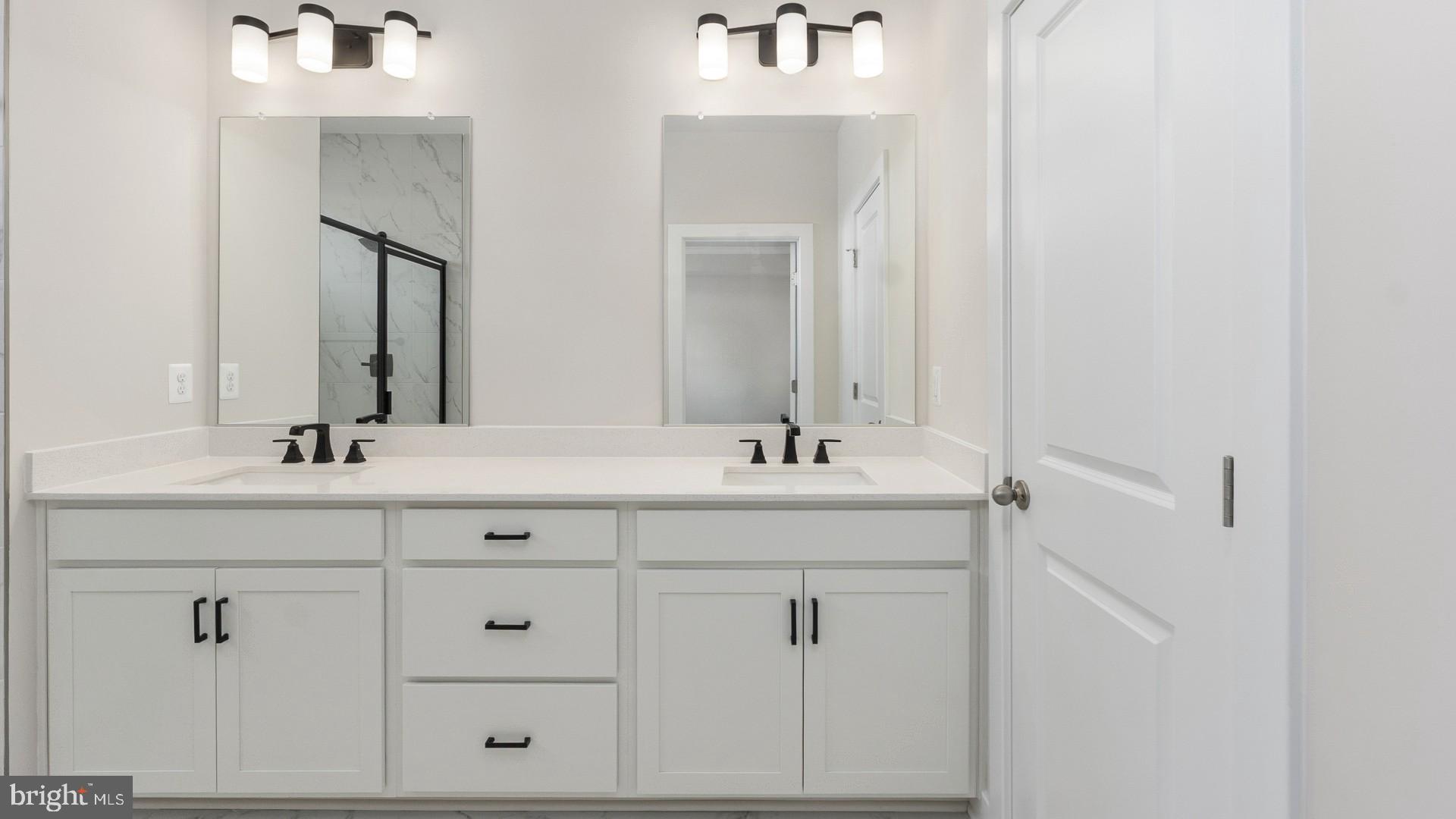 20821 Cloongee Terrace Sterling, VA 20166 - Photo 24 of 34 a bathroom with a sink vanity and a mirror