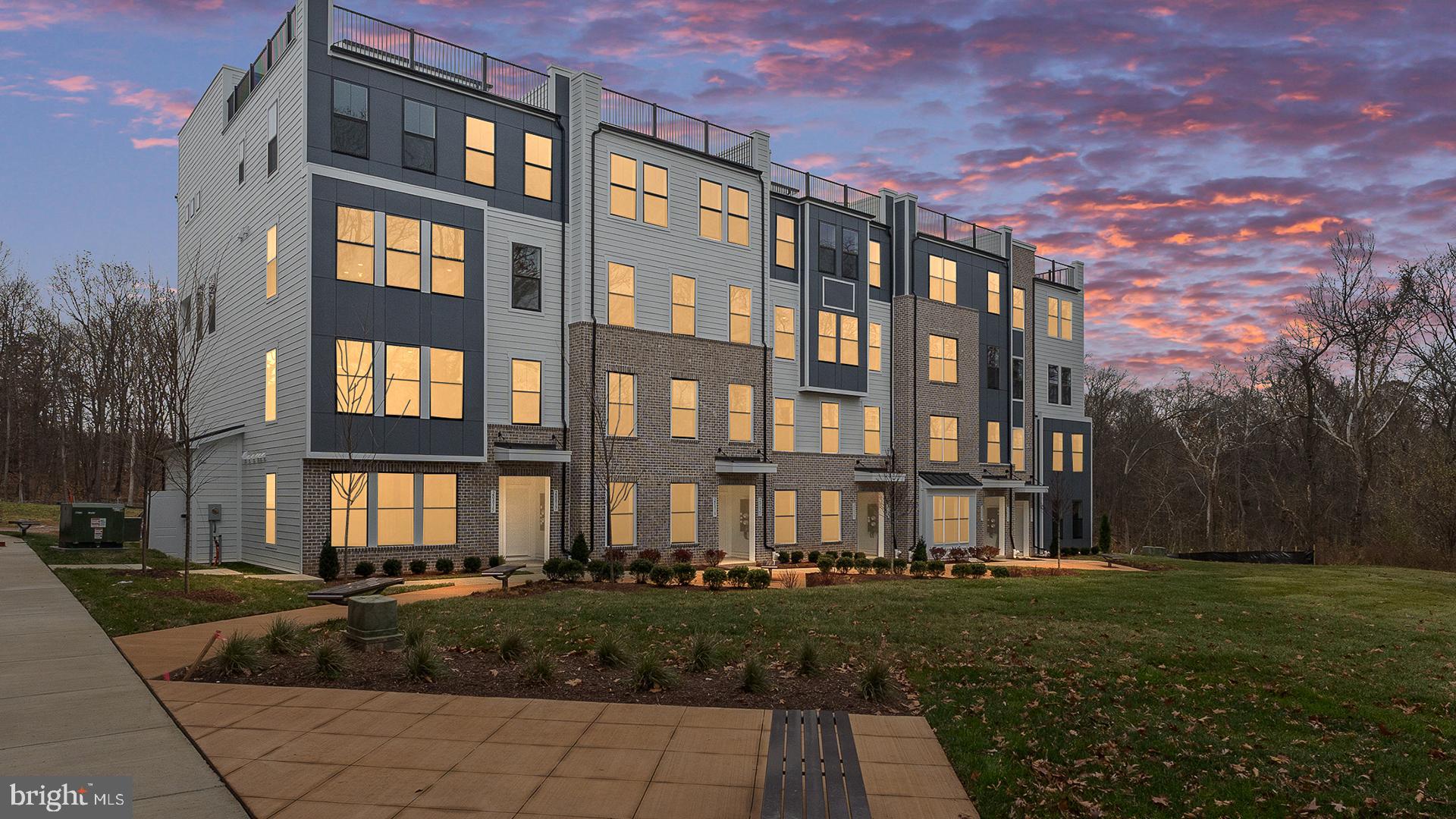 20821 Cloongee Terrace Sterling, VA 20166 - Photo 3 of 34 a front view of a building with garden