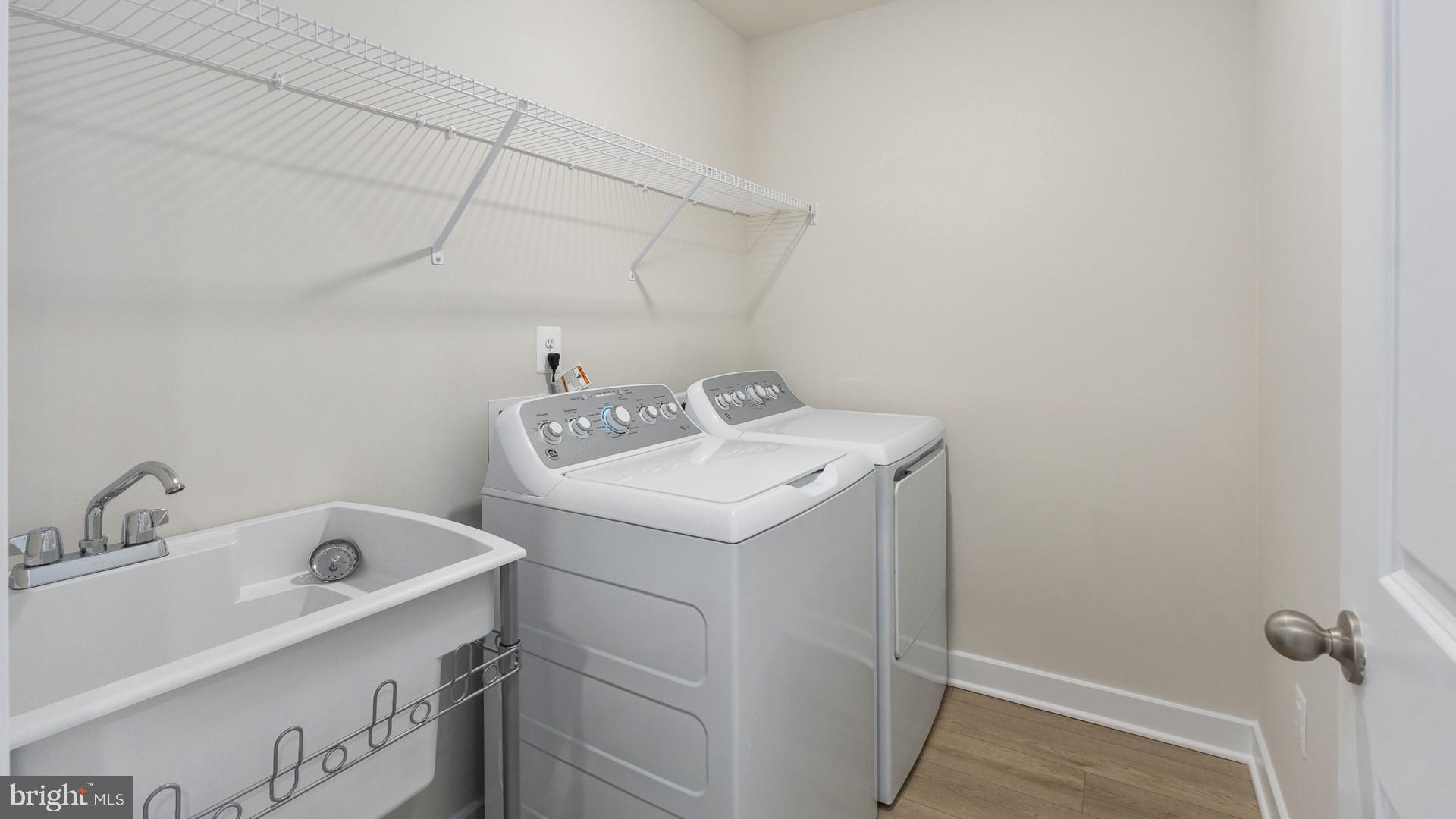 20821 Cloongee Terrace Sterling, VA 20166 - Photo 33 of 34 a utility room with dryer and washer
