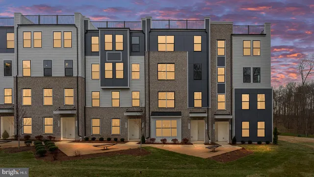 a front view of a building with a yard