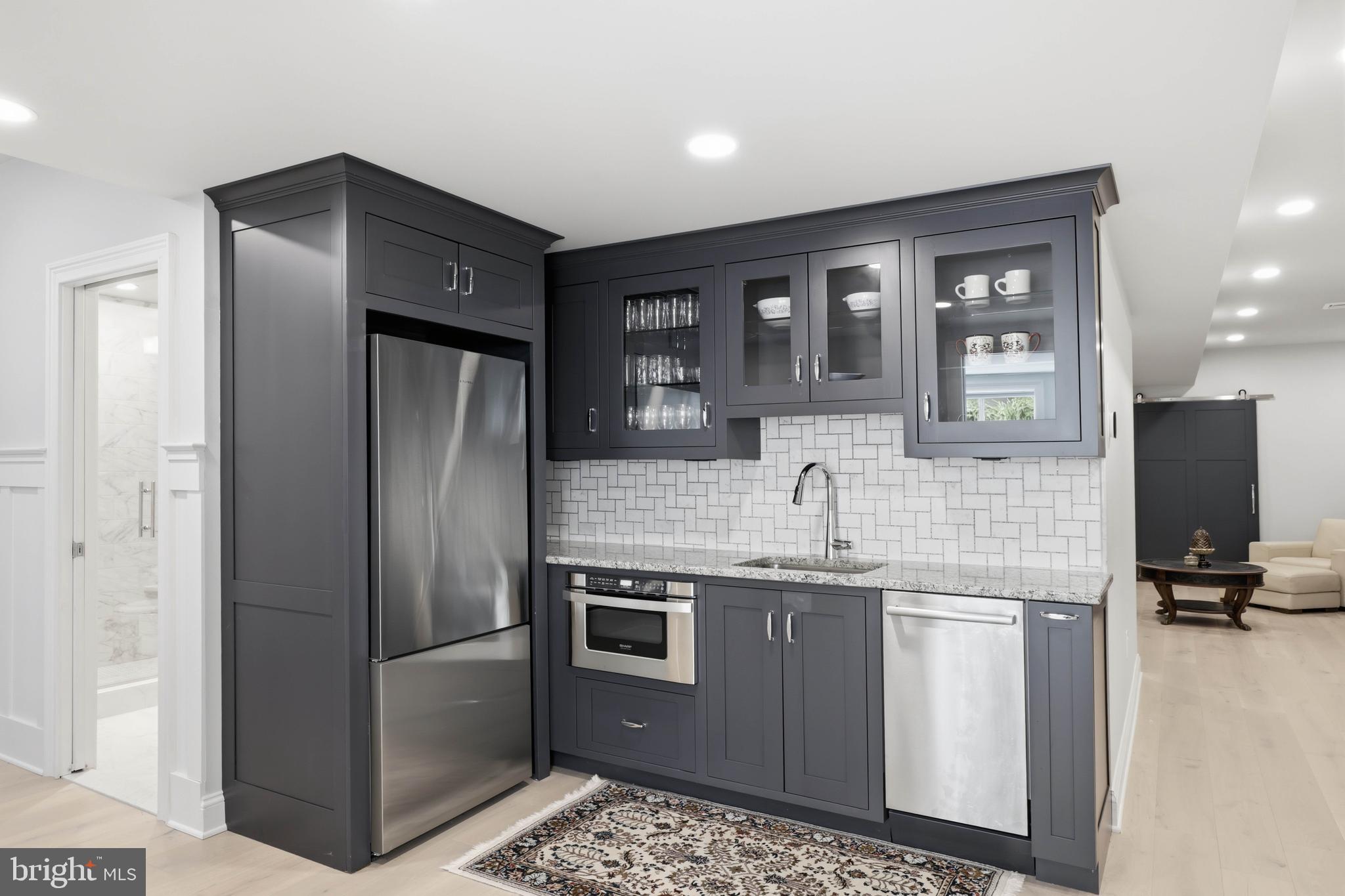 360 Addison Place Lancaster, PA 17601 - Photo 59 of 78 a kitchen with stainless steel appliances granite countertop a refrigerator and a sink