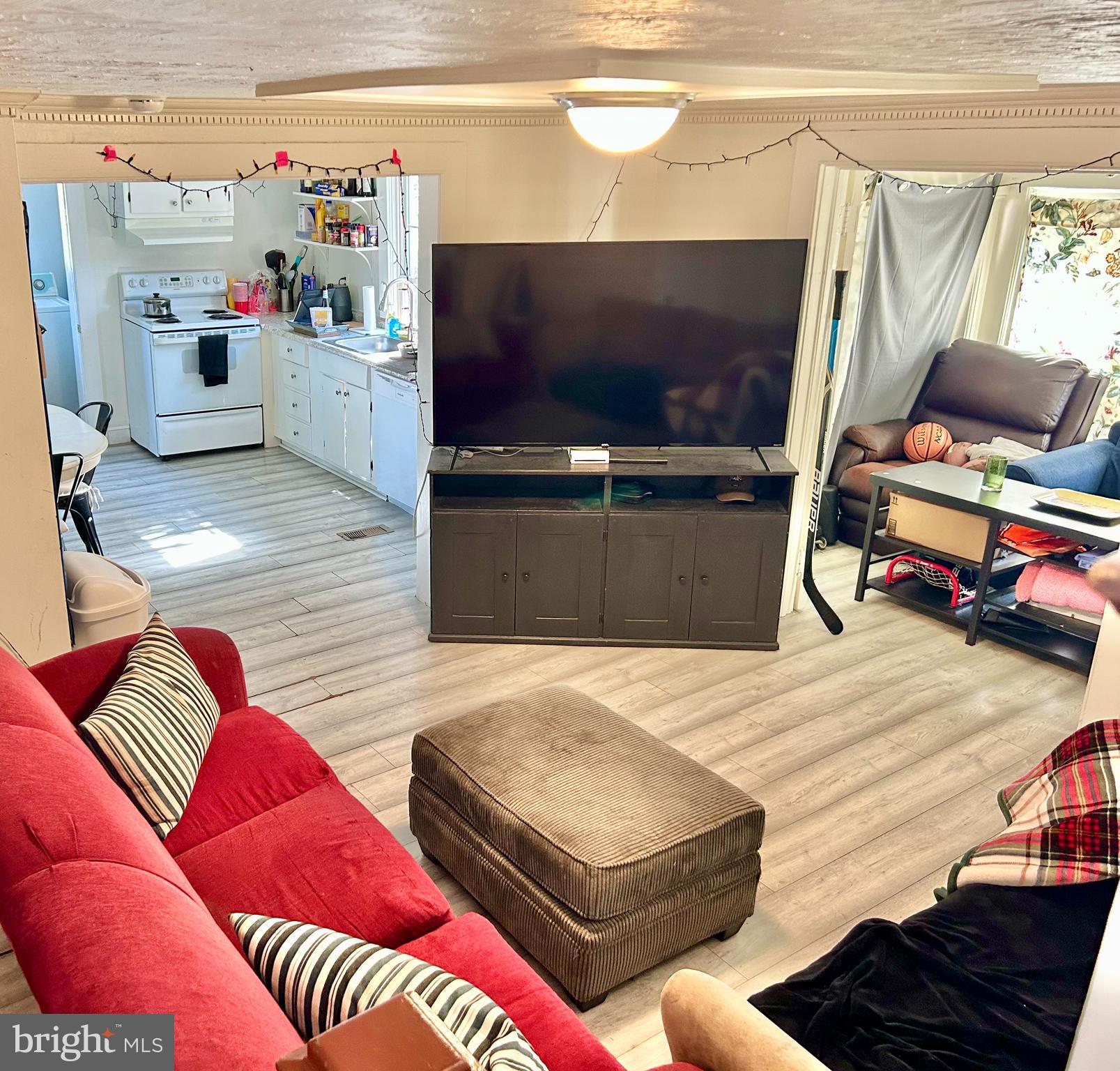 6 Cedar Avenue Towson, MD 21286 - Photo 6 of 10 a living room with furniture and a flat screen tv