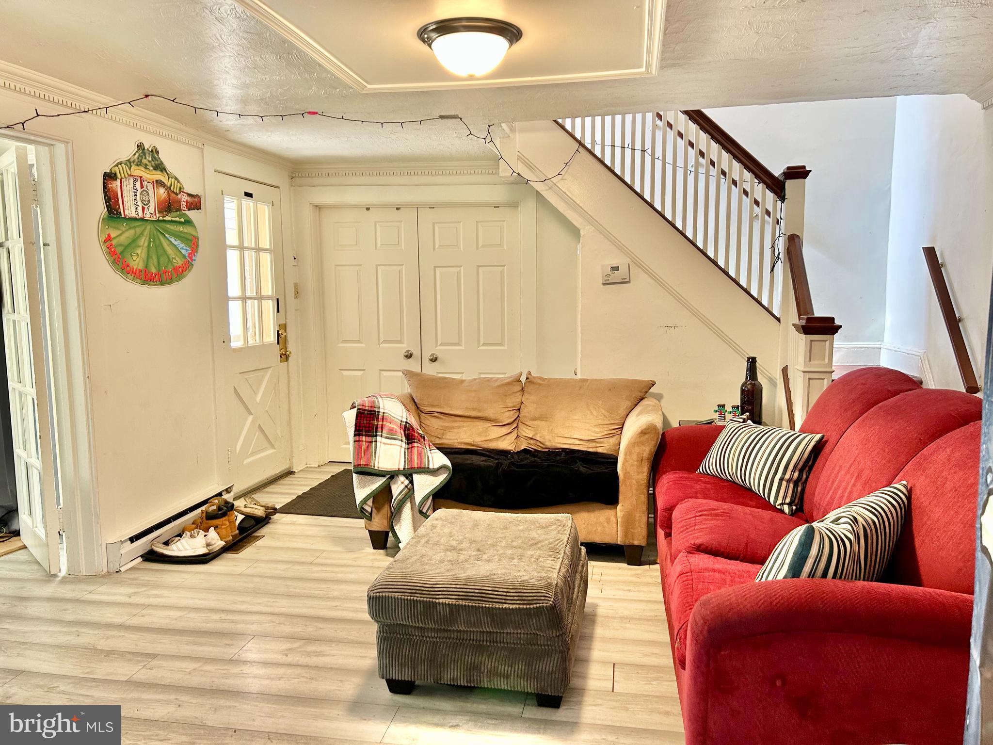 6 Cedar Avenue Towson, MD 21286 - Photo 8 of 10 a living room with furniture gym equipment and a window