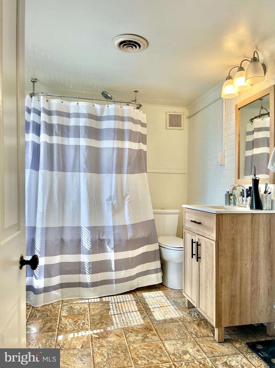 6 Cedar Avenue Towson, MD 21286 - Photo 10 of 10 a bathroom with a sink and a mirror