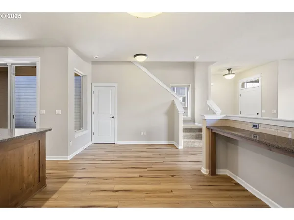 a view of a kitchen cabinets and wooden floor