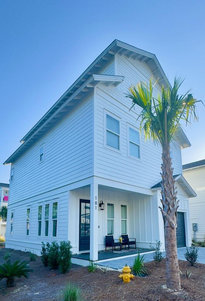 181 Valdare Ln Inlet Beach Inlet Beach, FL 32461 - Photo 1 of 32 a front view of a house with garden
