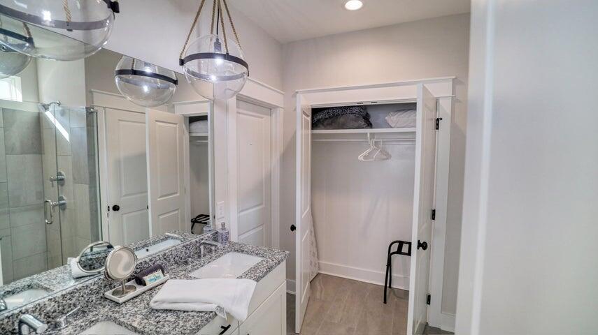 181 Valdare Ln Inlet Beach Inlet Beach, FL 32461 - Photo 12 of 32 a bedroom with a bed and a chandelier
