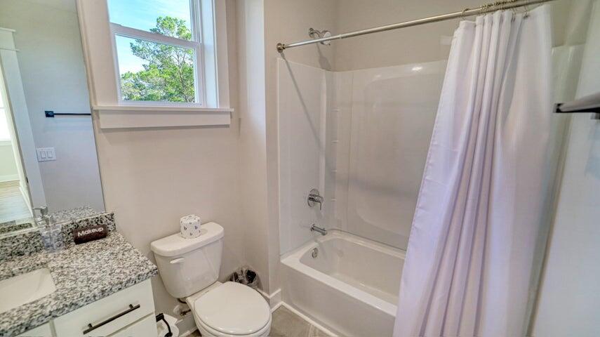181 Valdare Ln Inlet Beach Inlet Beach, FL 32461 - Photo 21 of 32 a bathroom with a granite countertop bathtub shower sink vanity and toilet