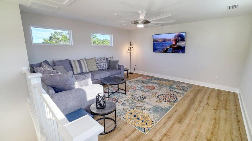 181 Valdare Ln Inlet Beach Inlet Beach, FL 32461 - Photo 23 of 32 a living room with furniture and a rug