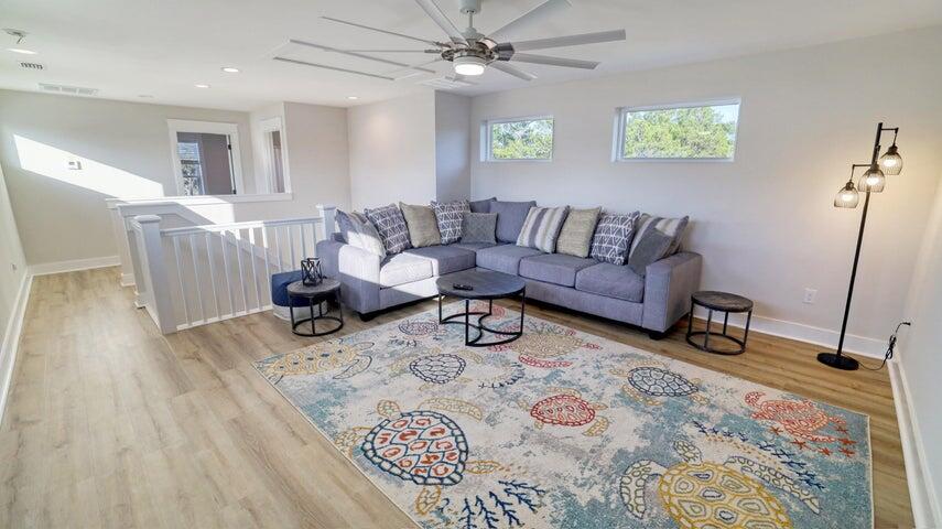 181 Valdare Ln Inlet Beach Inlet Beach, FL 32461 - Photo 24 of 32 a living room with furniture and a wooden floor