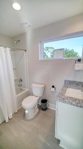 181 Valdare Ln Inlet Beach Inlet Beach, FL 32461 - Photo 26 of 32 a bathroom with a granite countertop sink a toilet and shower