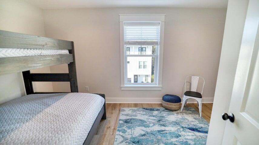 181 Valdare Ln Inlet Beach Inlet Beach, FL 32461 - Photo 27 of 32 a bedroom with a bed and a window