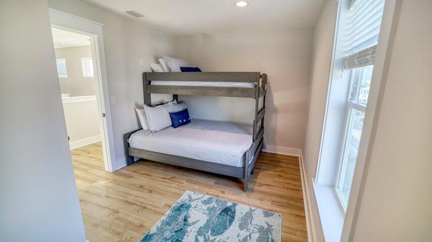 181 Valdare Ln Inlet Beach Inlet Beach, FL 32461 - Photo 28 of 32 a bedroom with a bed and wooden floor