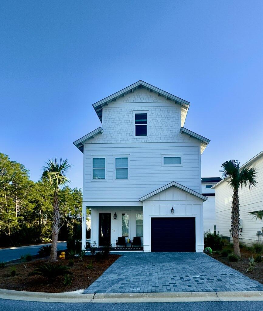 181 Valdare Ln Inlet Beach Inlet Beach, FL 32461 - Photo 3 of 32 a front view of a house with a yard