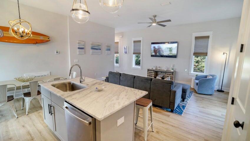 181 Valdare Ln Inlet Beach Inlet Beach, FL 32461 - Photo 7 of 32 a kitchen with a sink appliances and wooden floor