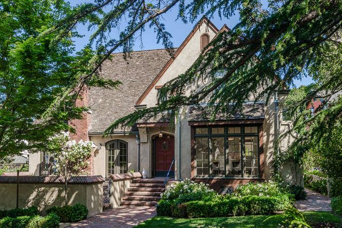 a front view of a house with garden