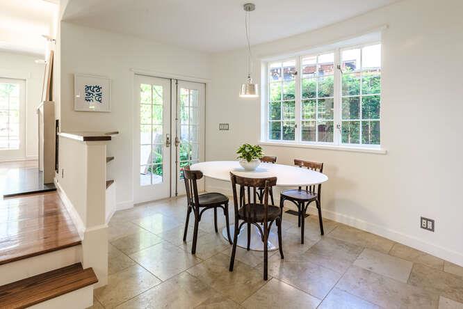 236 Clark Drive San Mateo, CA 94402 - Photo 25 of 58 a view of a dining room with furniture and a potted plant