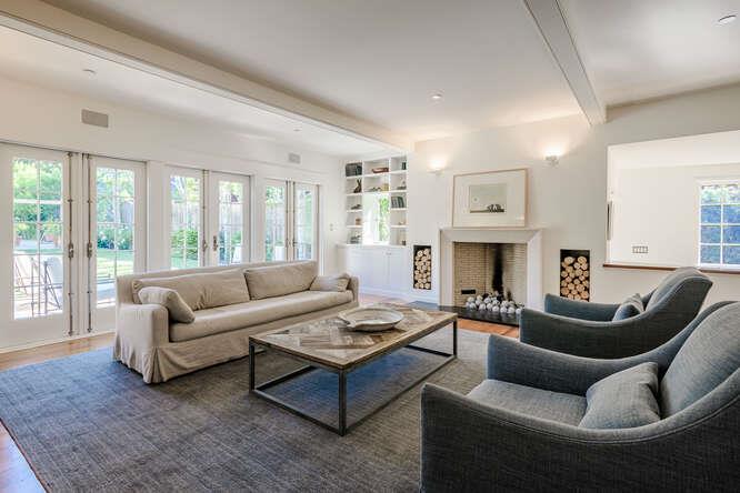 236 Clark Drive San Mateo, CA 94402 - Photo 29 of 58 a living room with furniture fireplace and a large window