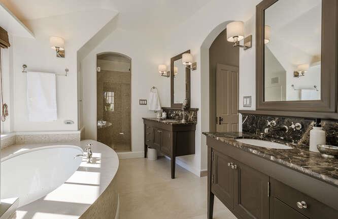 236 Clark Drive San Mateo, CA 94402 - Photo 37 of 58 a bathroom with a tub a double vanity sink and mirror