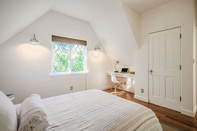 236 Clark Drive San Mateo, CA 94402 - Photo 40 of 58 a bedroom with a bed and wooden floor