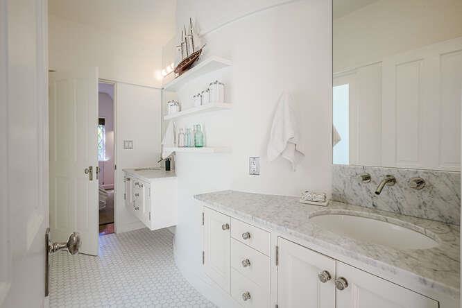 236 Clark Drive San Mateo, CA 94402 - Photo 42 of 58 a bathroom with a granite countertop sink mirror and a toilet