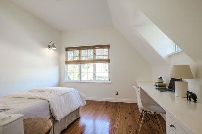 236 Clark Drive San Mateo, CA 94402 - Photo 45 of 58 a bedroom with a bed and a wooden floor