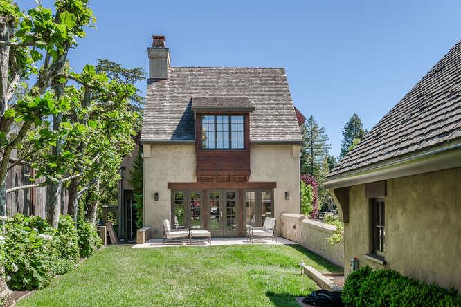 236 Clark Drive San Mateo, CA 94402 - Photo 57 of 58 a front view of a house with garden and sitting area