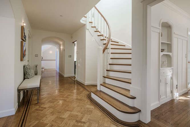 236 Clark Drive San Mateo, CA 94402 - Photo 8 of 58 a view of a hallway with entryway wooden floor and front door