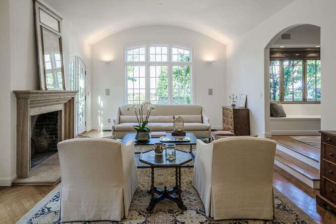 236 Clark Drive San Mateo, CA 94402 - Photo 9 of 58 a living room with furniture a large window and a fireplace