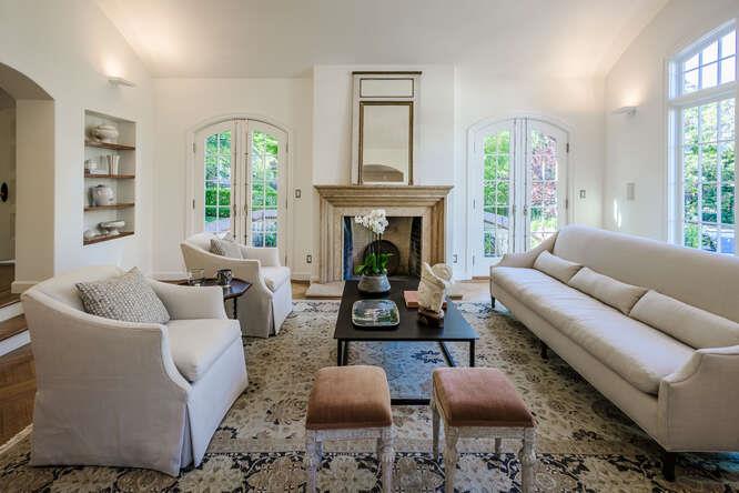 236 Clark Drive San Mateo, CA 94402 - Photo 10 of 58 a living room with furniture fireplace and a large window