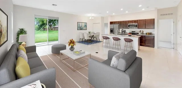 a kitchen with granite countertop a sink and a stove top oven