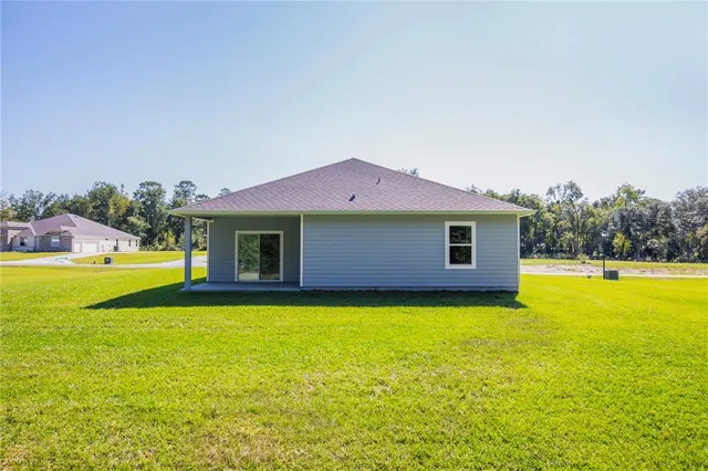 a front view of a house with swimming pool