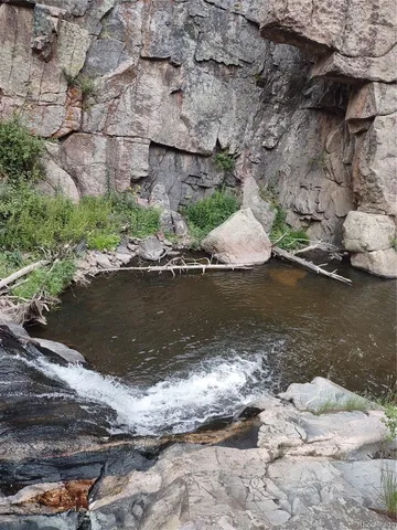 a view of a wooden floor next to a lake view