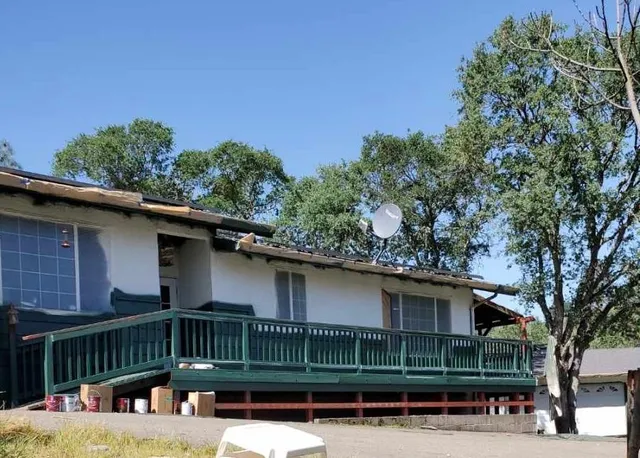 a view of a chair and table in the balcony