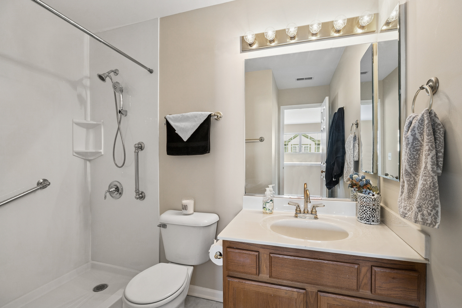 961 Sumac Court Lindenhurst, IL 60046 - Photo 13 of 22 a bathroom with a sink toilet vanity and shower