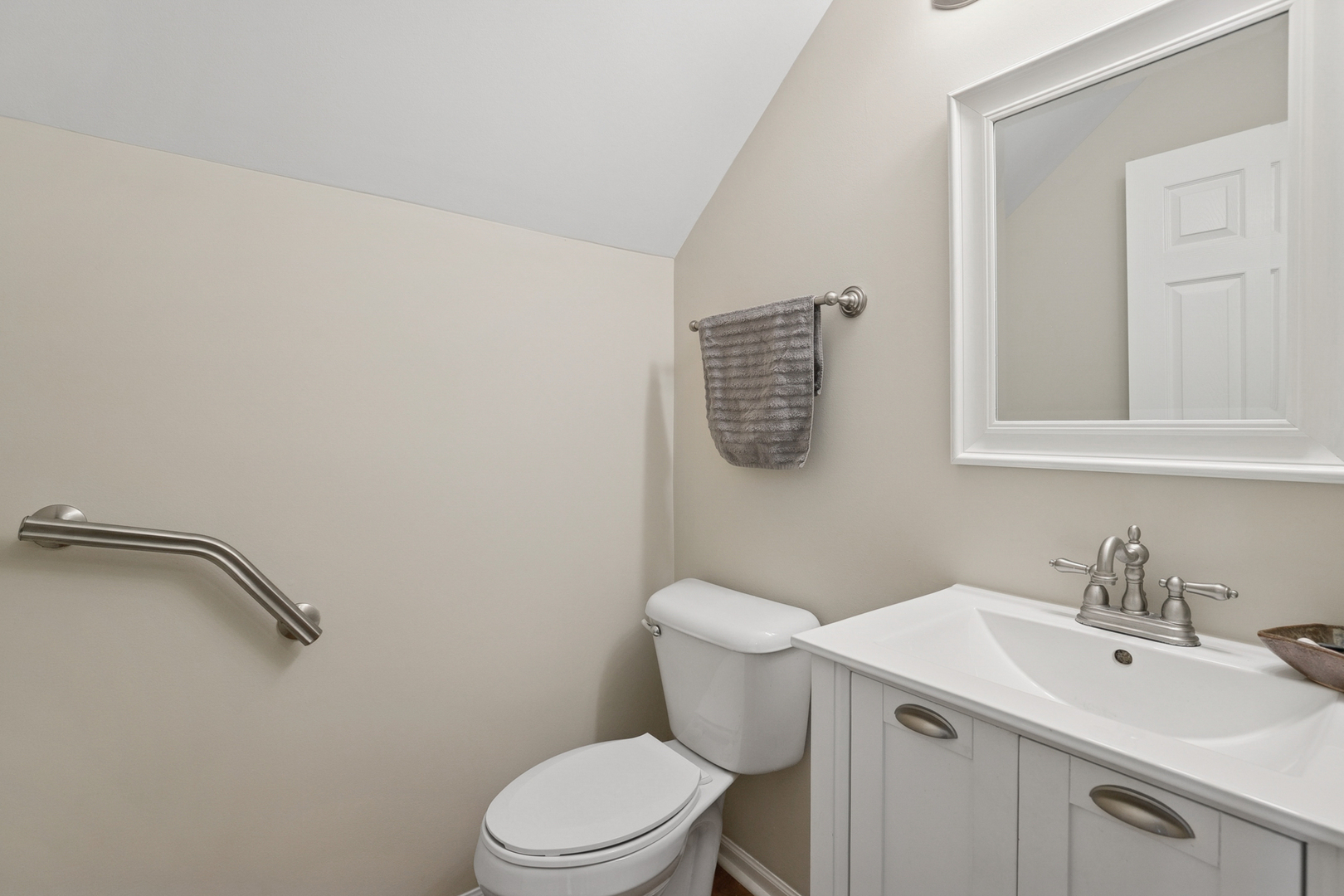 961 Sumac Court Lindenhurst, IL 60046 - Photo 20 of 22 a white toilet sitting next to a bathroom sink