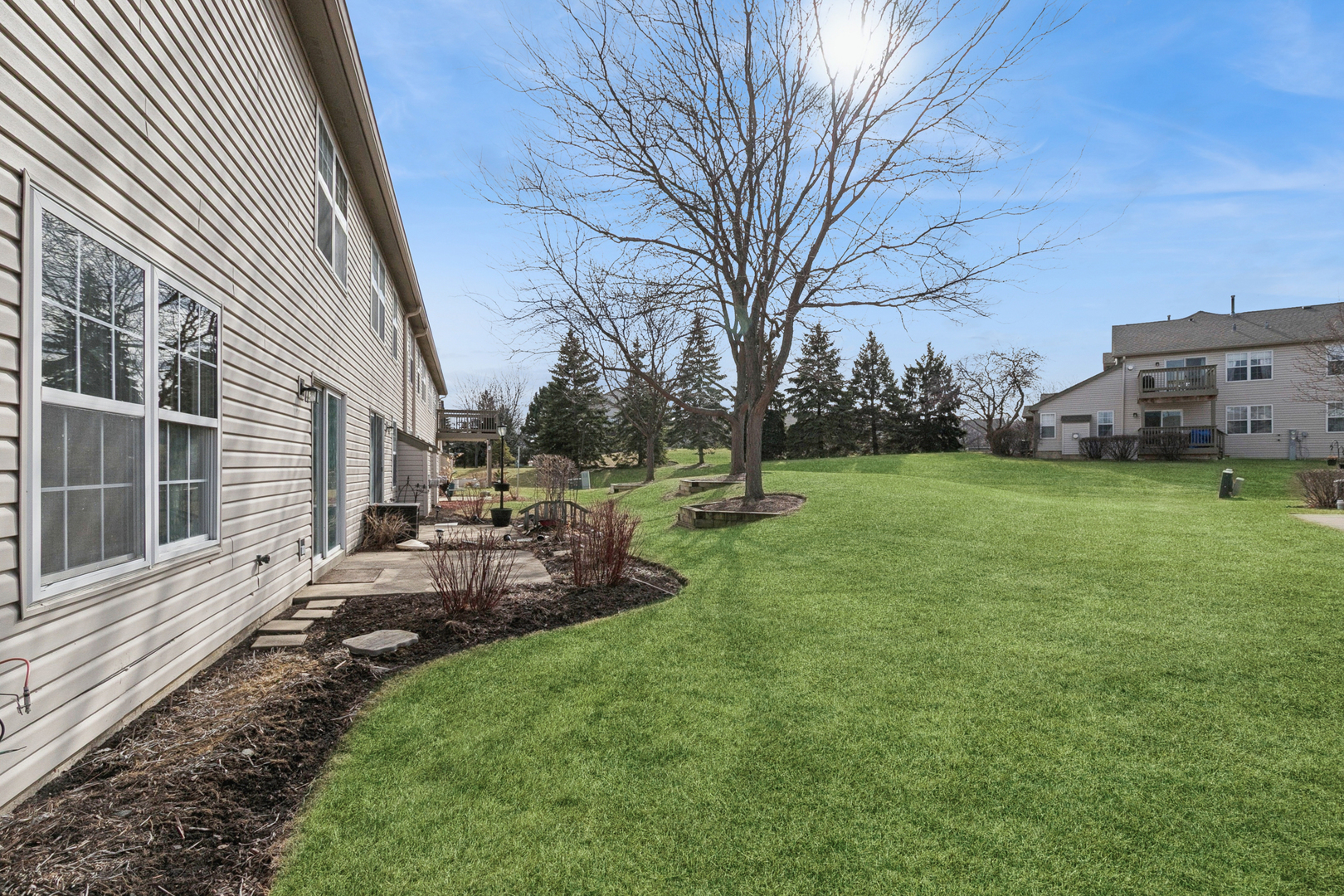 961 Sumac Court Lindenhurst, IL 60046 - Photo 21 of 22 a view of a backyard with a garden
