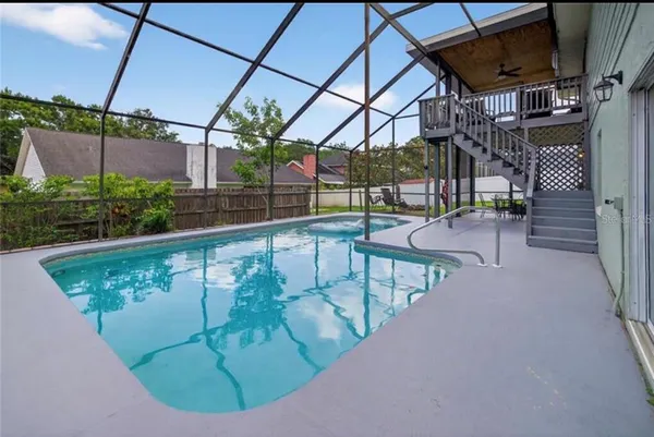 a view of a swimming pool with a patio