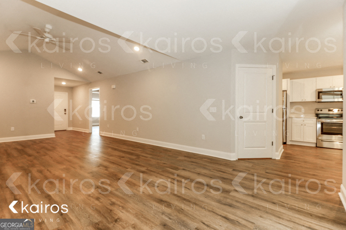 153 Cottage Grove Road Brunswick, GA 31525 - Photo 4 of 16 a view of a hallway with a kitchen