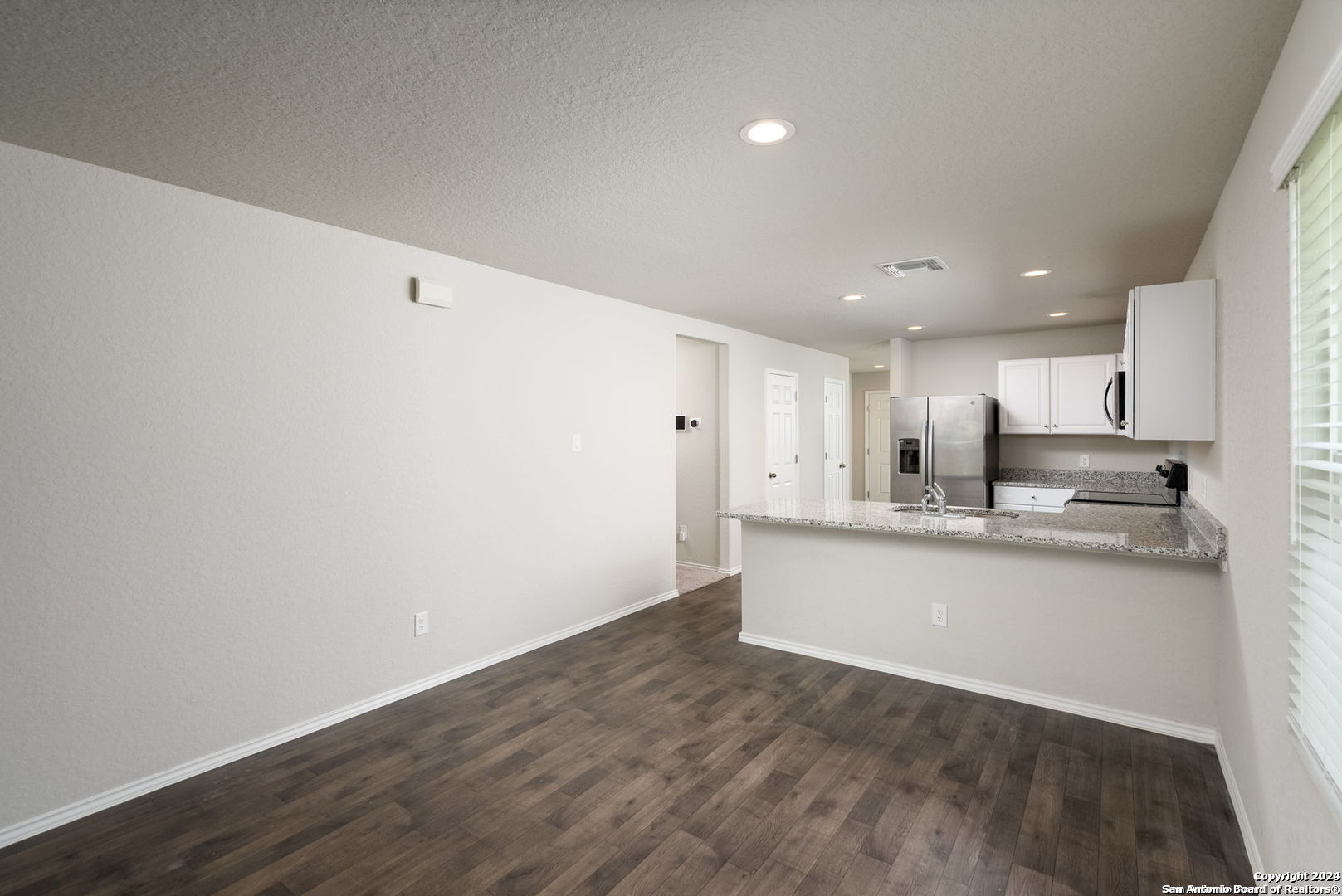 3619 Storm Moon Converse, TX 78109 - Photo 11 of 28 a kitchen with stainless steel appliances a refrigerator and a sink