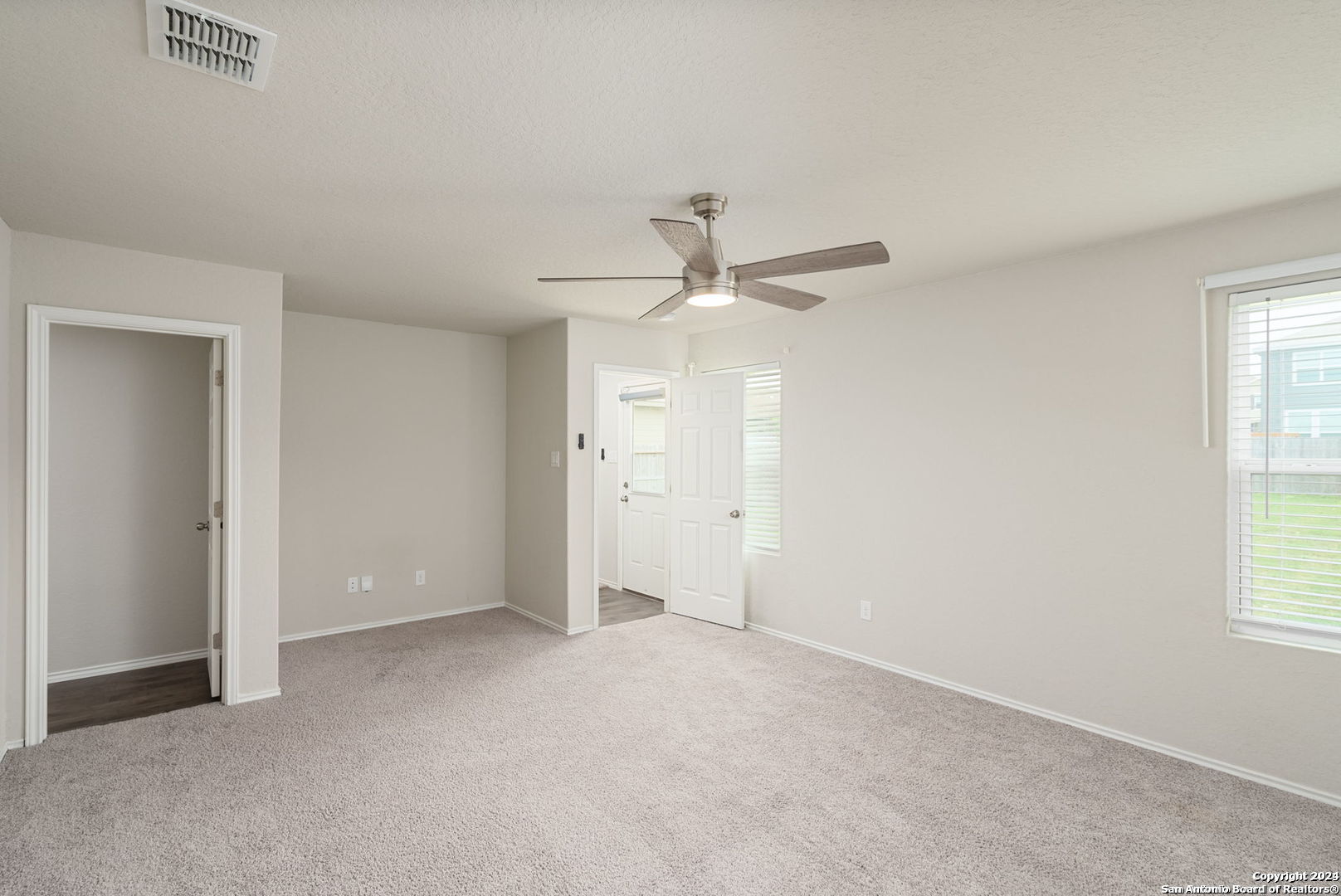 3619 Storm Moon Converse, TX 78109 - Photo 16 of 28 an empty room with a ceiling fan and a window