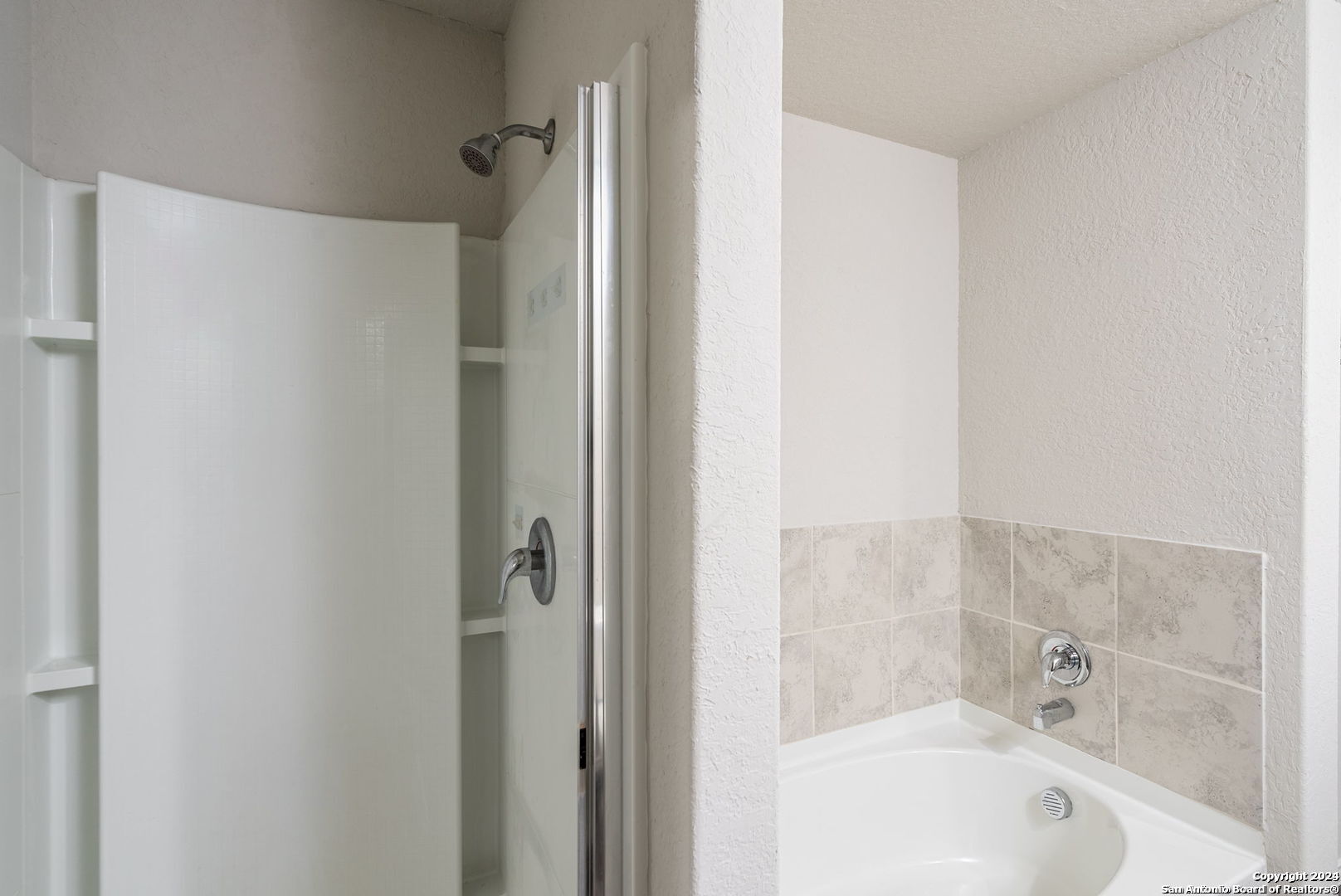 3619 Storm Moon Converse, TX 78109 - Photo 18 of 28 a bathroom with a bathtub and shower