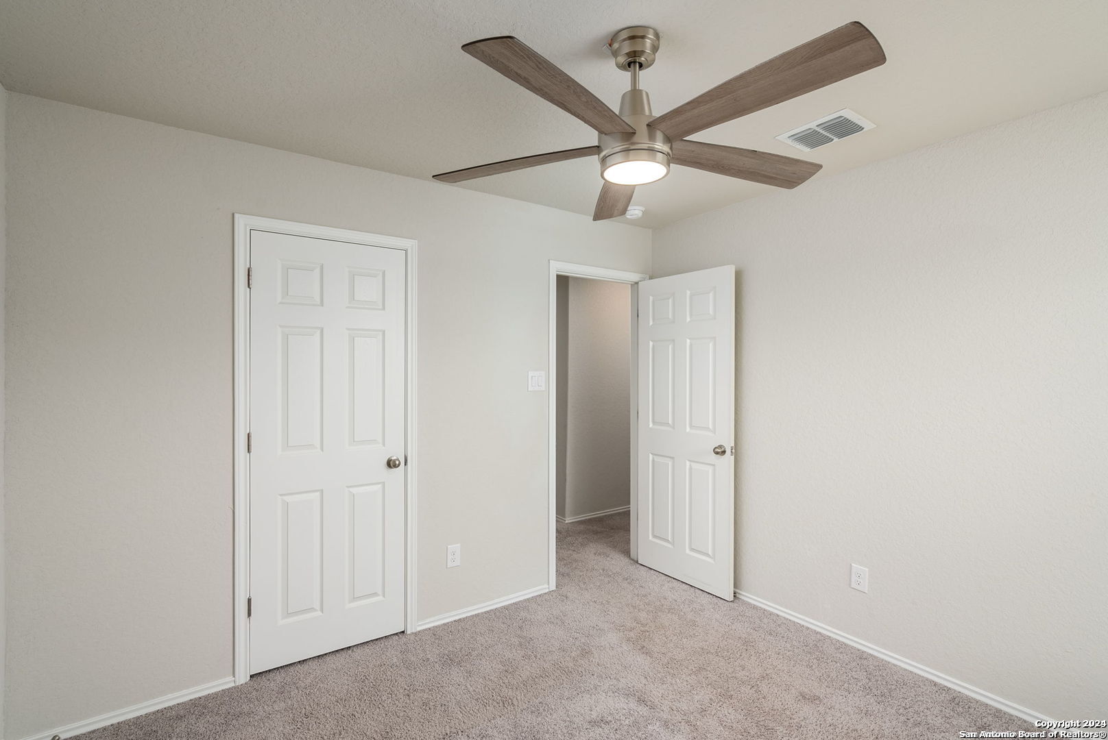 3619 Storm Moon Converse, TX 78109 - Photo 21 of 28 an empty room with a ceiling fan and a ceiling fan