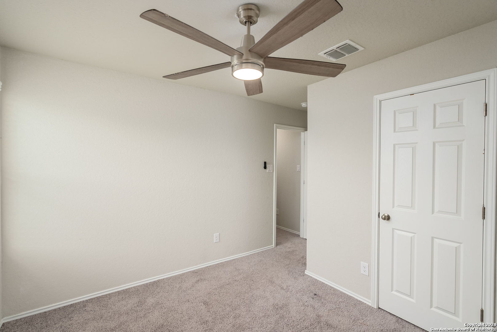 3619 Storm Moon Converse, TX 78109 - Photo 23 of 28 an empty room with a ceiling fan and a ceiling fan