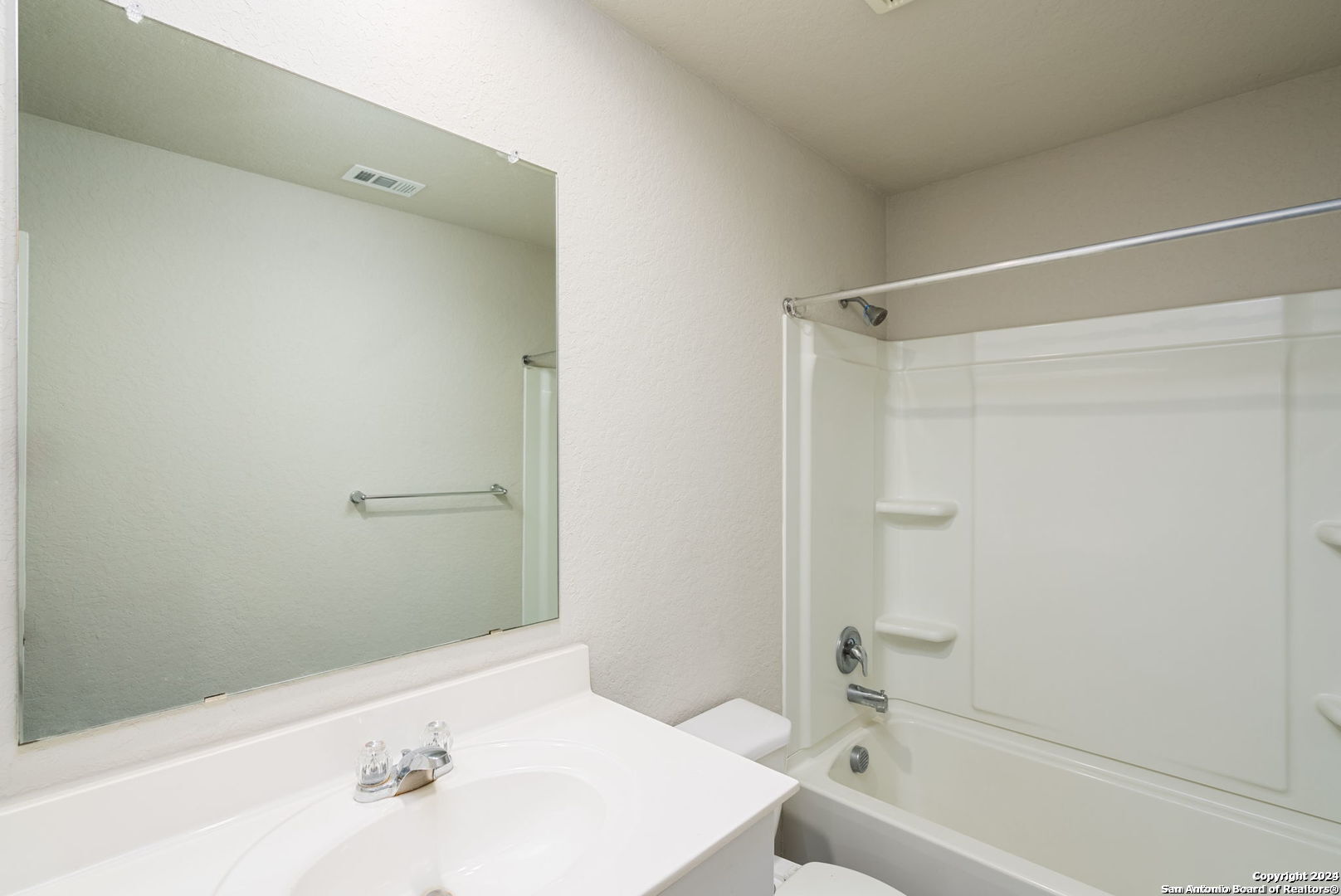 3619 Storm Moon Converse, TX 78109 - Photo 24 of 28 a bathroom with a bathtub and a sink
