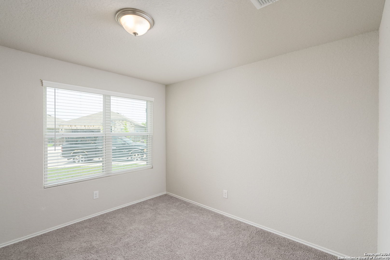 3619 Storm Moon Converse, TX 78109 - Photo 5 of 28 an empty room with a window
