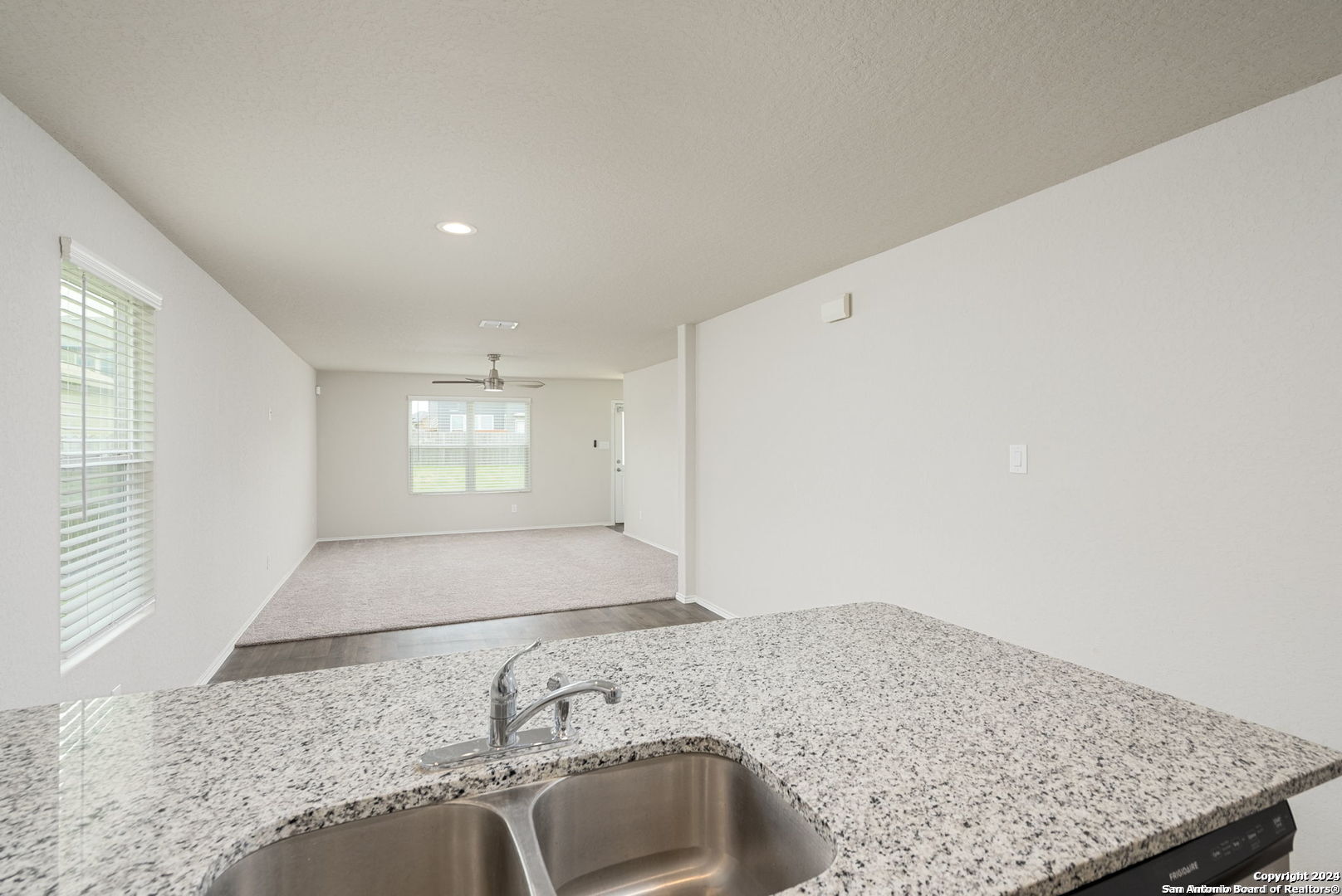 3619 Storm Moon Converse, TX 78109 - Photo 9 of 28 a view of a kitchen with a sink and dishwasher