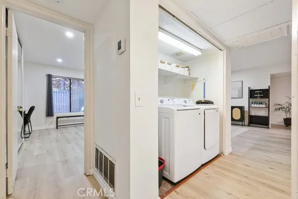 a view of a kitchen cabinets and wooden floor