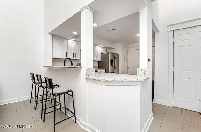 a view of a kitchen from the dining room